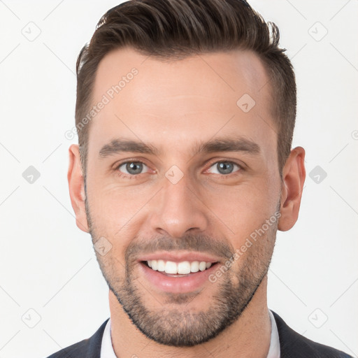 Joyful white young-adult male with short  brown hair and brown eyes