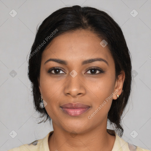 Joyful black young-adult female with medium  black hair and brown eyes