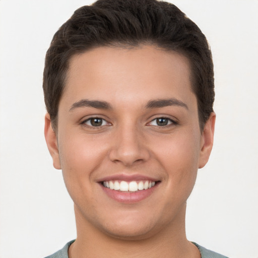 Joyful white young-adult female with short  brown hair and brown eyes