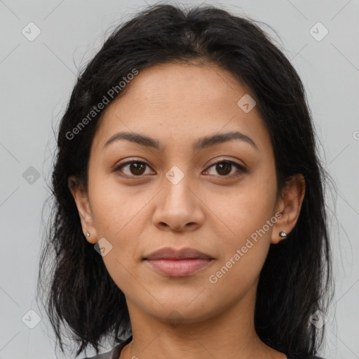 Joyful latino young-adult female with long  brown hair and brown eyes