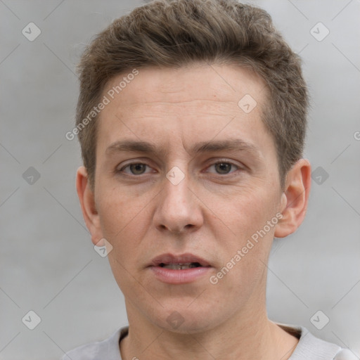 Joyful white adult male with short  brown hair and grey eyes