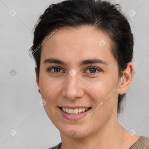 Joyful white young-adult female with short  brown hair and brown eyes