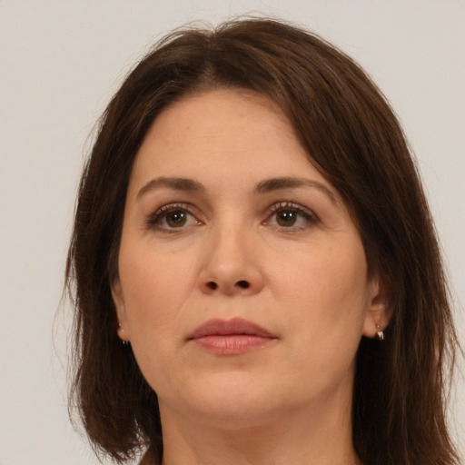 Neutral white adult female with long  brown hair and brown eyes