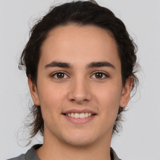 Joyful white young-adult male with medium  brown hair and brown eyes