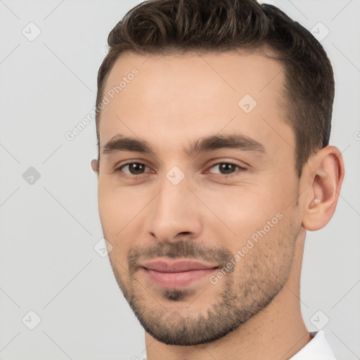 Joyful white young-adult male with short  brown hair and brown eyes