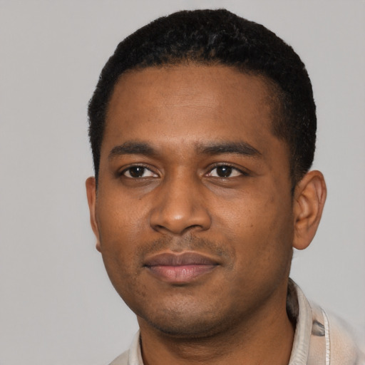 Neutral black young-adult male with short  black hair and brown eyes