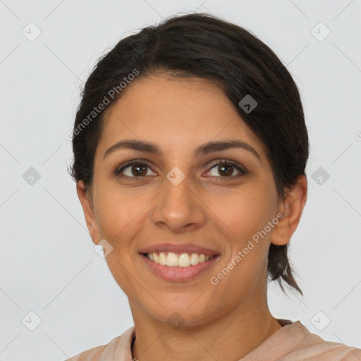 Joyful latino young-adult female with short  brown hair and brown eyes