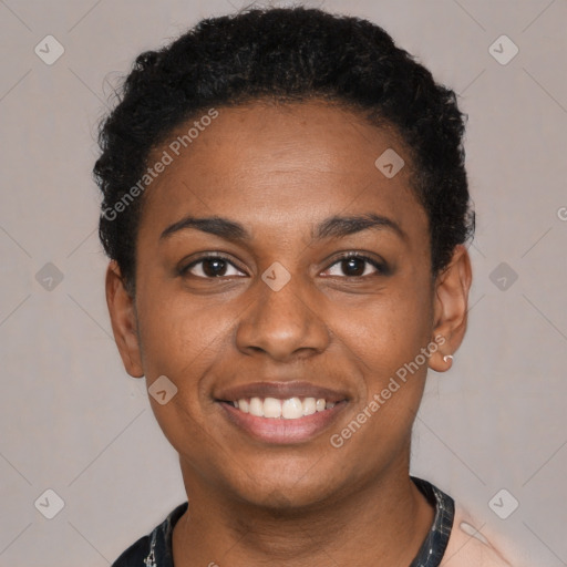 Joyful black young-adult female with short  black hair and brown eyes