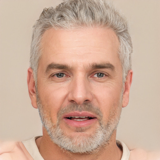 Joyful white adult male with short  gray hair and brown eyes