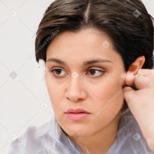 Neutral white young-adult female with medium  brown hair and brown eyes