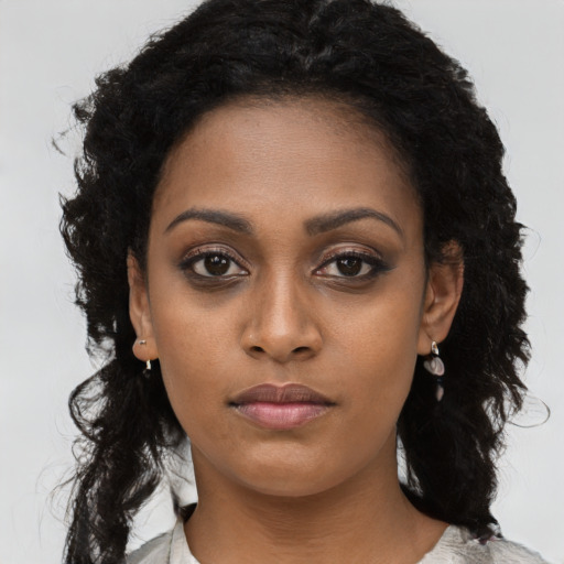 Neutral black young-adult female with long  black hair and brown eyes