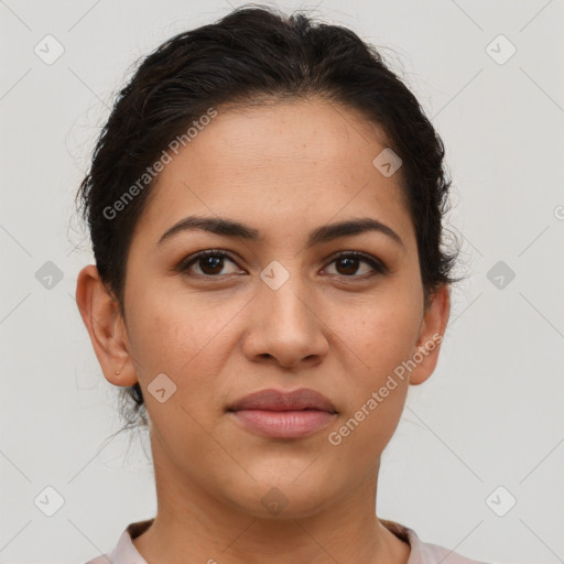 Joyful latino young-adult female with short  brown hair and brown eyes