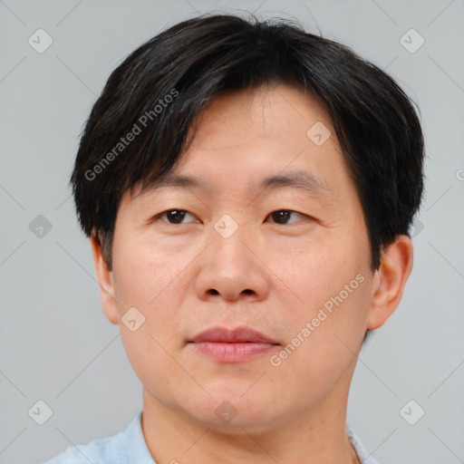 Neutral asian adult male with short  brown hair and brown eyes