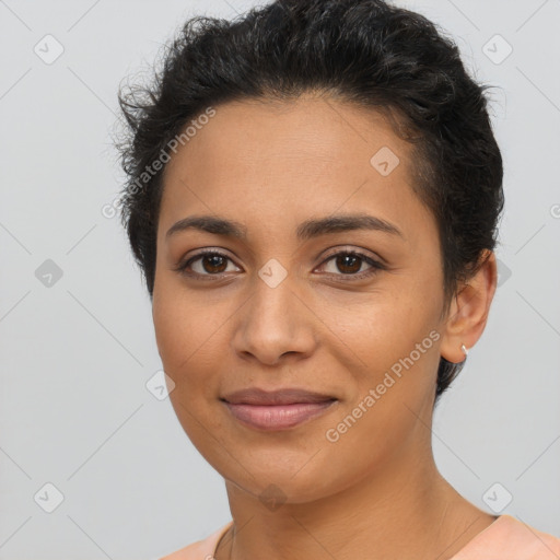 Joyful latino young-adult female with short  brown hair and brown eyes