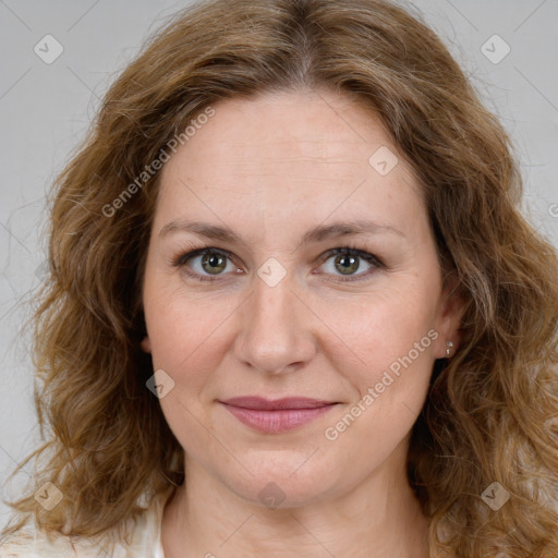 Joyful white young-adult female with medium  brown hair and green eyes