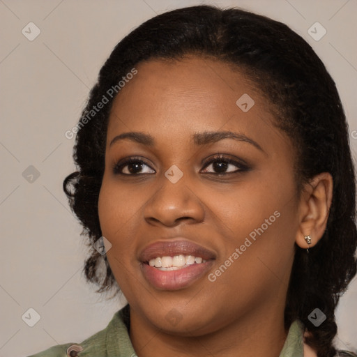 Joyful black young-adult female with medium  black hair and brown eyes