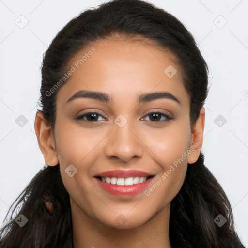 Joyful latino young-adult female with long  brown hair and brown eyes