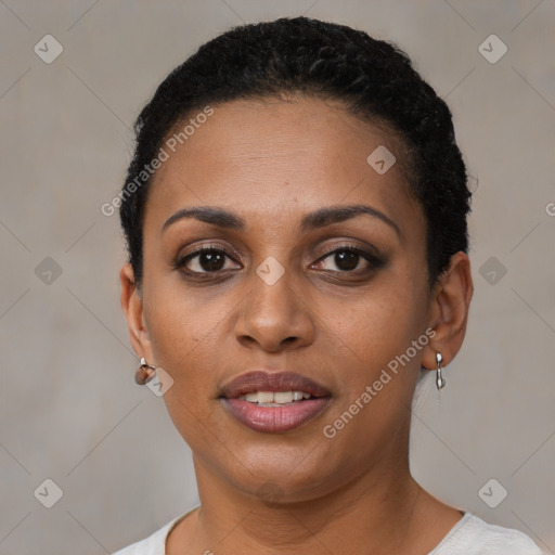 Joyful black young-adult female with short  brown hair and brown eyes