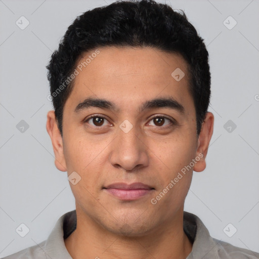 Joyful latino young-adult male with short  black hair and brown eyes