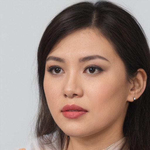 Neutral asian young-adult female with long  brown hair and brown eyes