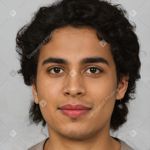 Joyful latino young-adult male with short  brown hair and brown eyes