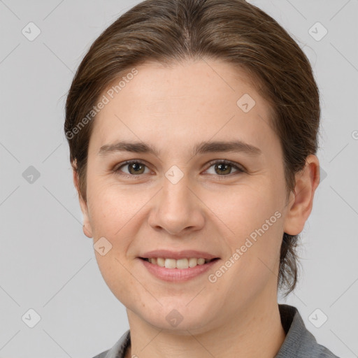 Joyful white young-adult female with medium  brown hair and grey eyes