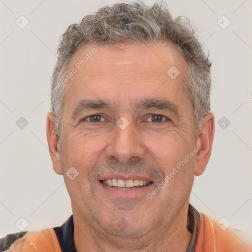 Joyful white middle-aged male with short  brown hair and brown eyes