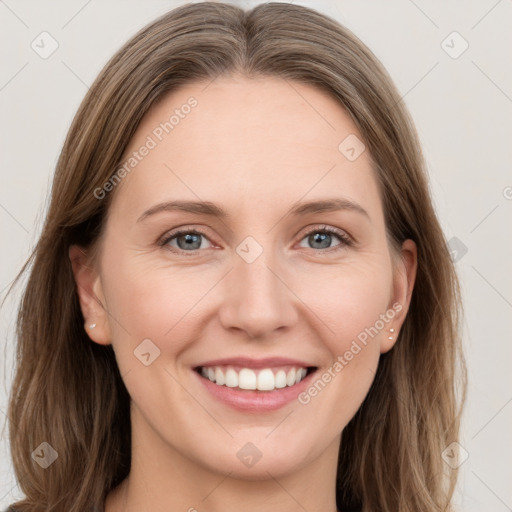 Joyful white young-adult female with long  brown hair and grey eyes