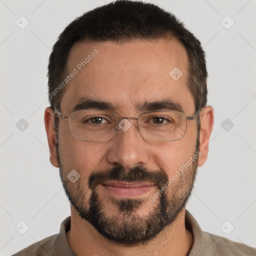 Joyful white adult male with short  black hair and brown eyes