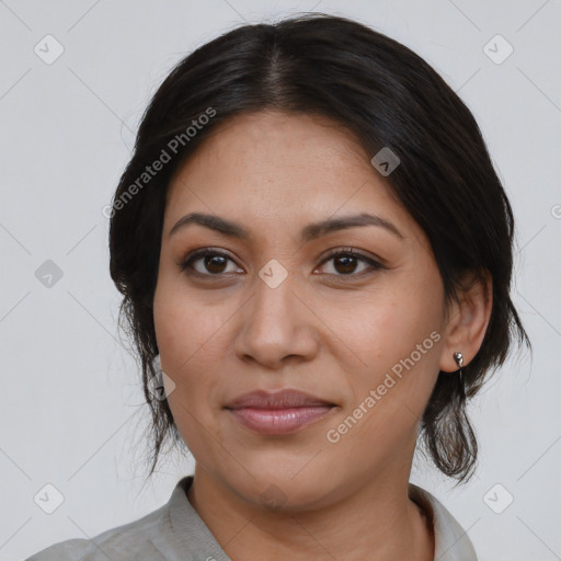 Joyful latino young-adult female with medium  black hair and brown eyes