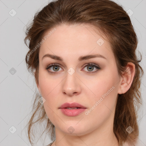 Joyful white young-adult female with medium  brown hair and green eyes