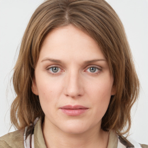 Neutral white young-adult female with medium  brown hair and grey eyes