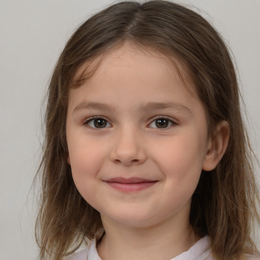 Joyful white child female with medium  brown hair and brown eyes