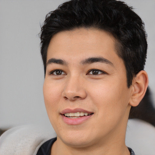Joyful asian young-adult male with short  black hair and brown eyes