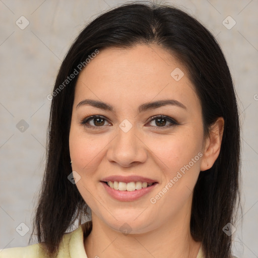 Joyful latino young-adult female with medium  brown hair and brown eyes