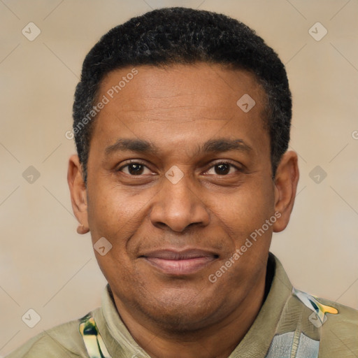 Joyful latino adult male with short  brown hair and brown eyes