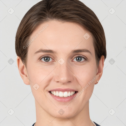 Joyful white young-adult female with short  brown hair and grey eyes