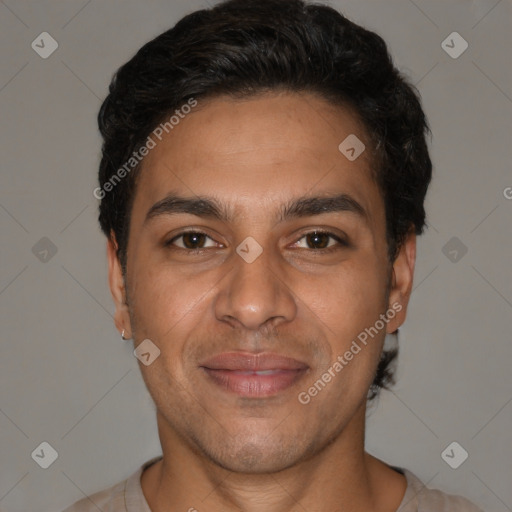 Joyful latino young-adult male with short  brown hair and brown eyes