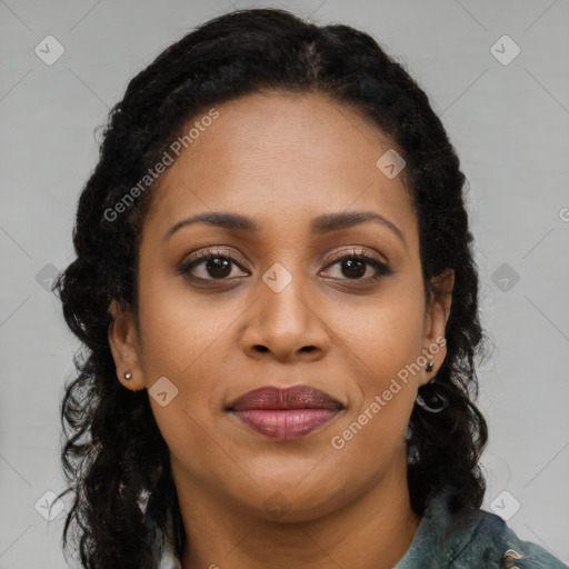 Joyful black young-adult female with long  brown hair and brown eyes