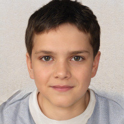 Joyful white child male with short  brown hair and brown eyes