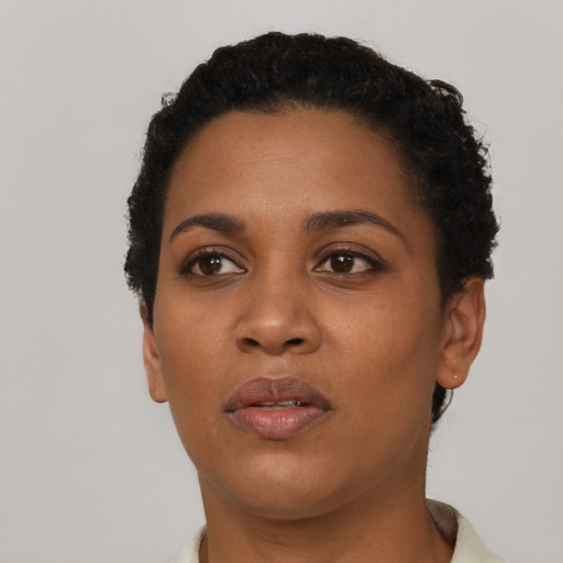 Neutral black young-adult female with short  brown hair and brown eyes