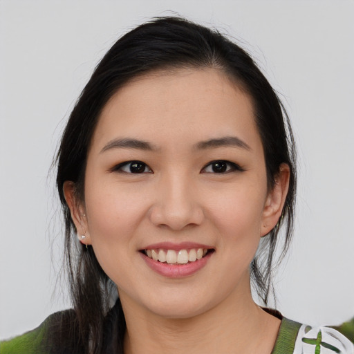Joyful white young-adult female with medium  black hair and brown eyes