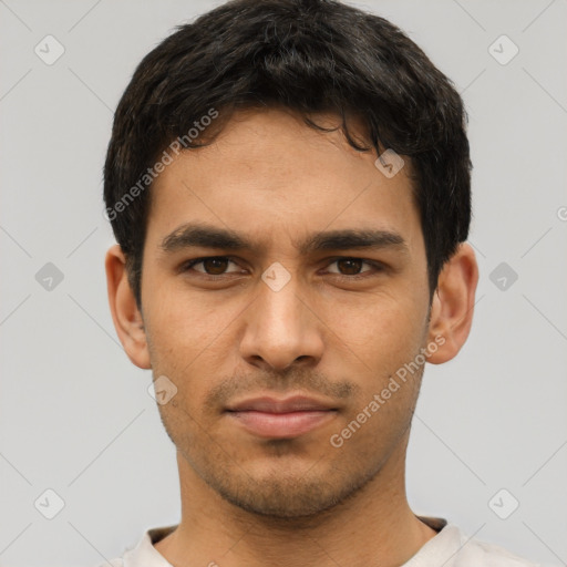 Neutral latino young-adult male with short  brown hair and brown eyes