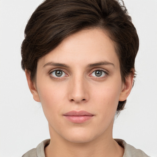 Neutral white young-adult female with short  brown hair and brown eyes