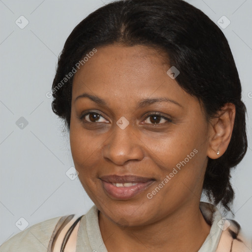 Joyful black adult female with medium  brown hair and brown eyes