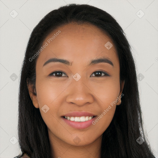 Joyful latino young-adult female with long  brown hair and brown eyes