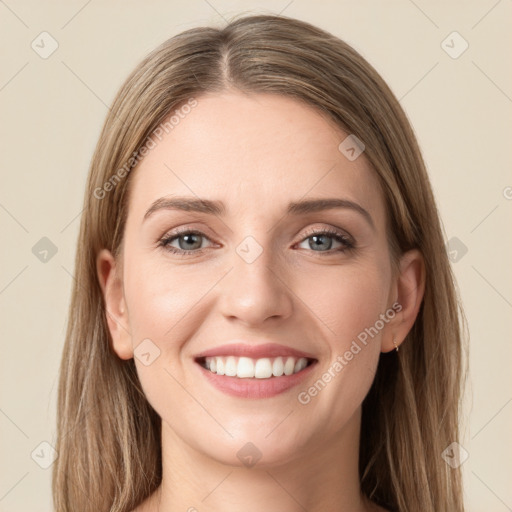 Joyful white young-adult female with long  brown hair and green eyes