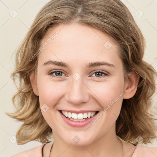 Joyful white young-adult female with medium  brown hair and green eyes