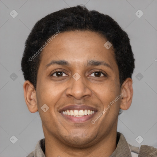 Joyful latino adult male with short  brown hair and brown eyes