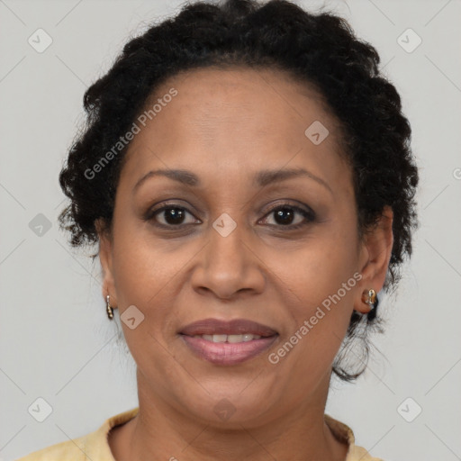 Joyful latino adult female with medium  brown hair and brown eyes